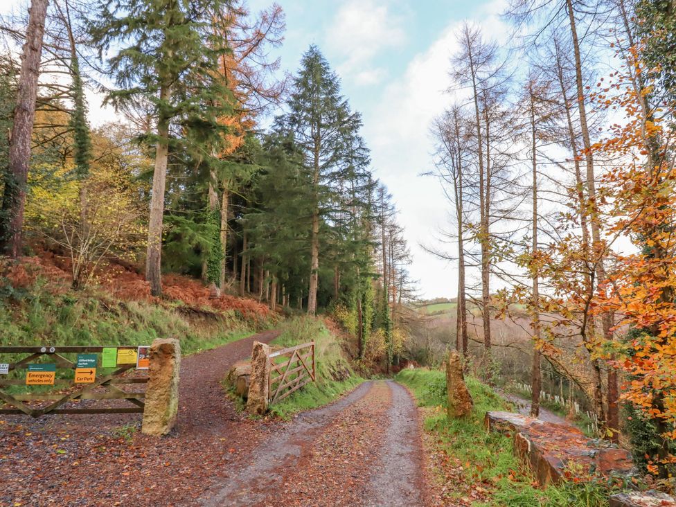 A pathway with a gate and trees at Clifford Lodge Barn