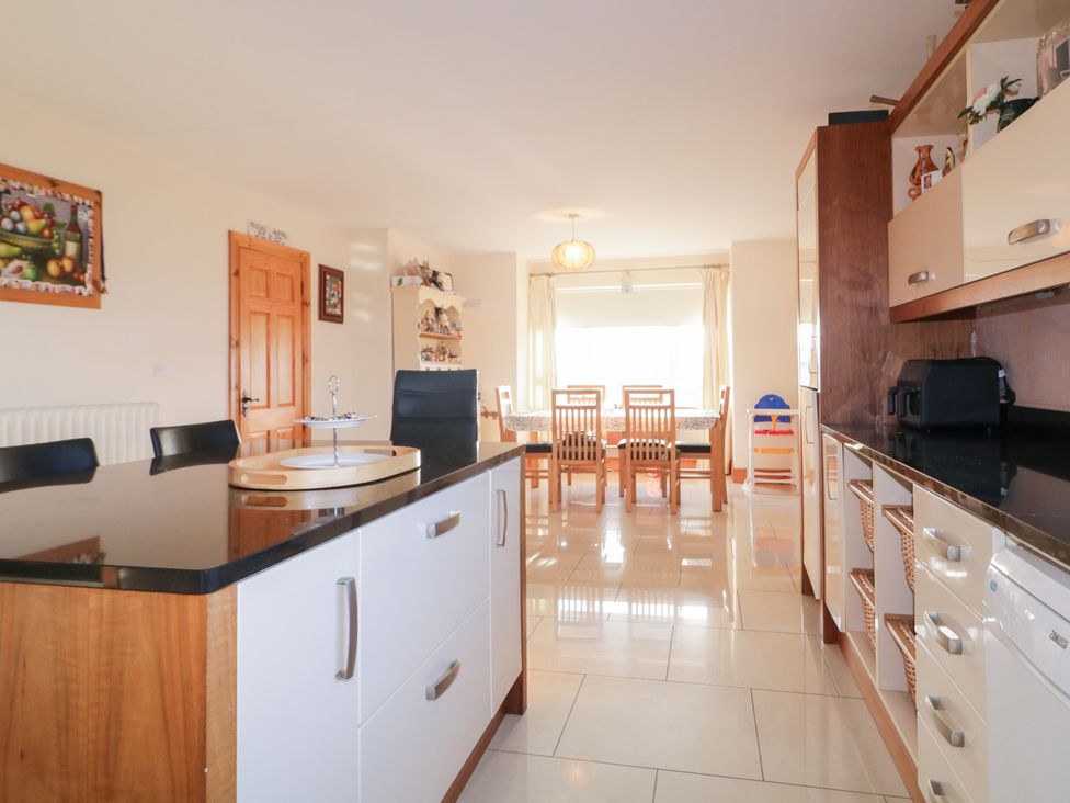 A kitchen with a dining area at Storey and Half House Annagry