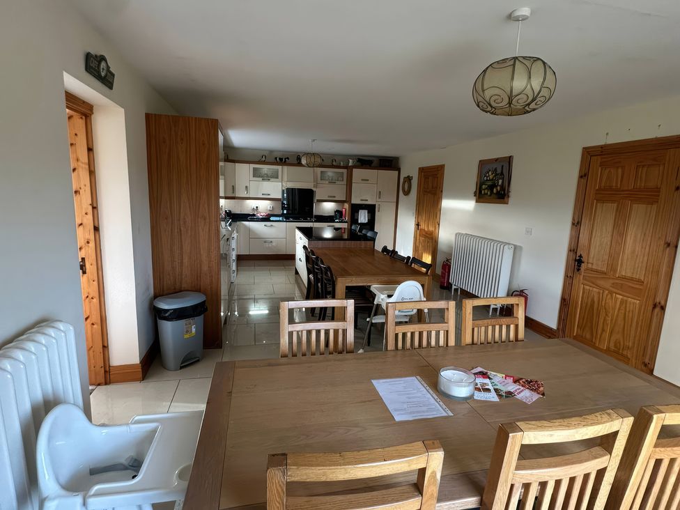 A kitchen with dining table and chairs at Storey and Half House near Annagry, County Donegal