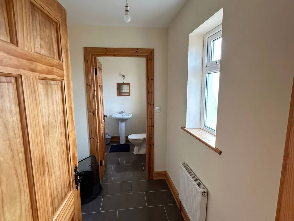A bathroom with a sink and toilet at Storey and Half House Near Annagry, County Donegal