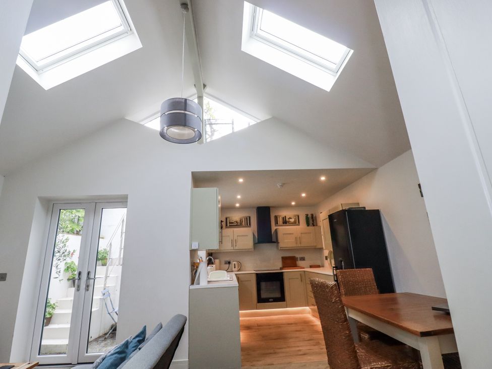 A kitchen with skylights and modern appliances at Cove Retreat in Penzance