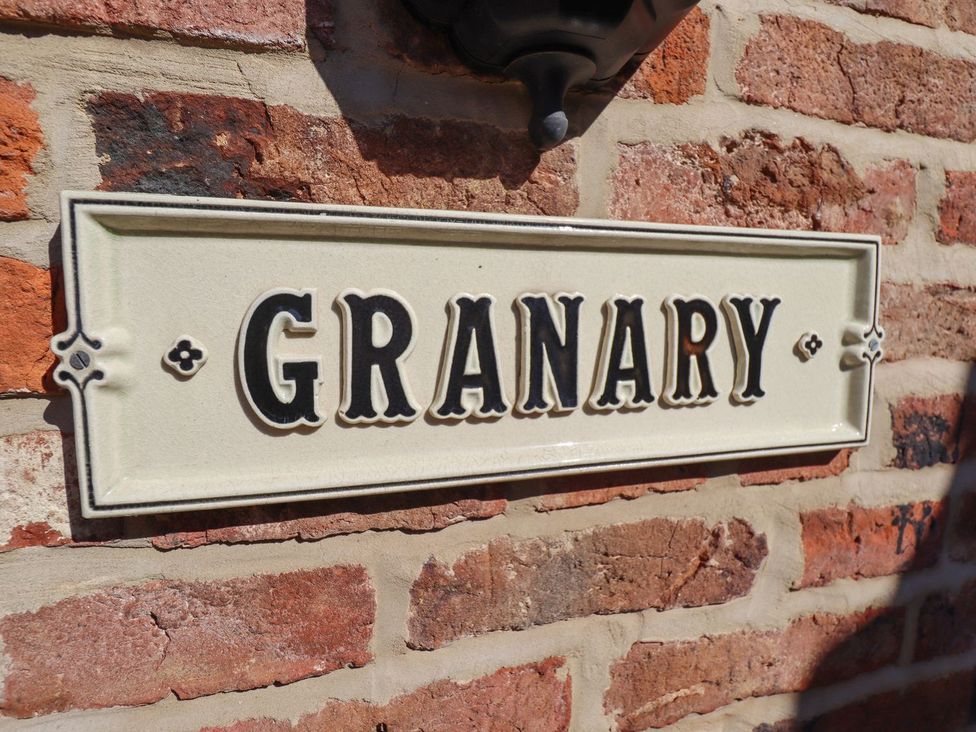 A sign that reads GRANARY on a brick wall at The Granary Louth