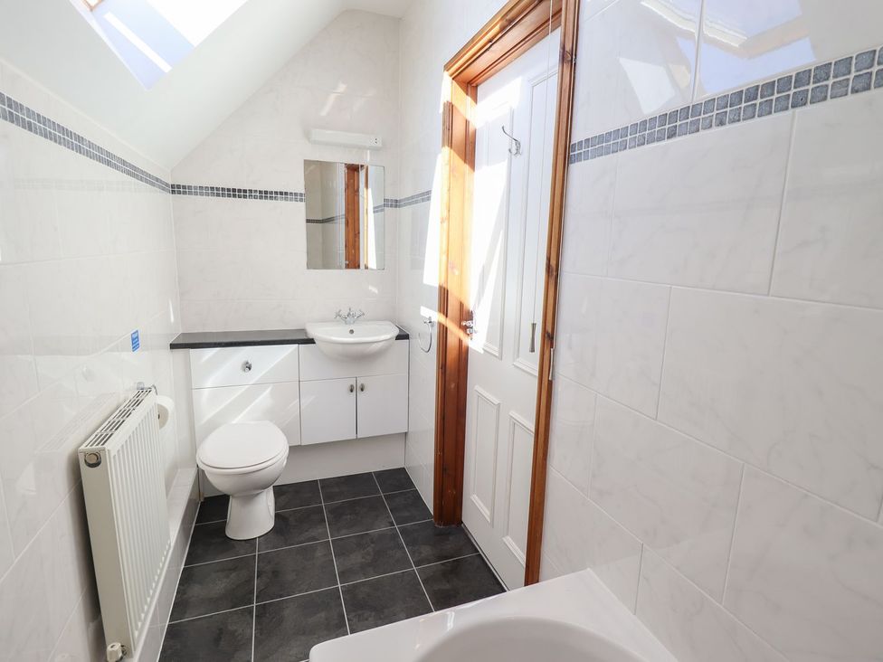 A bathroom with a sink and toilet at The Granary in Louth