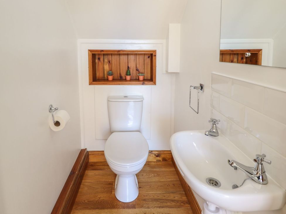 A bathroom with a toilet and a sink at The Granary in Louth