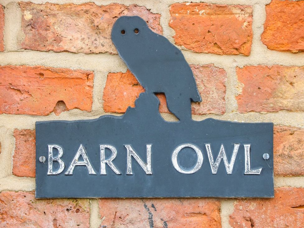 A sign displaying 'BARN OWL' with an owl silhouette at Barn Owl in Louth