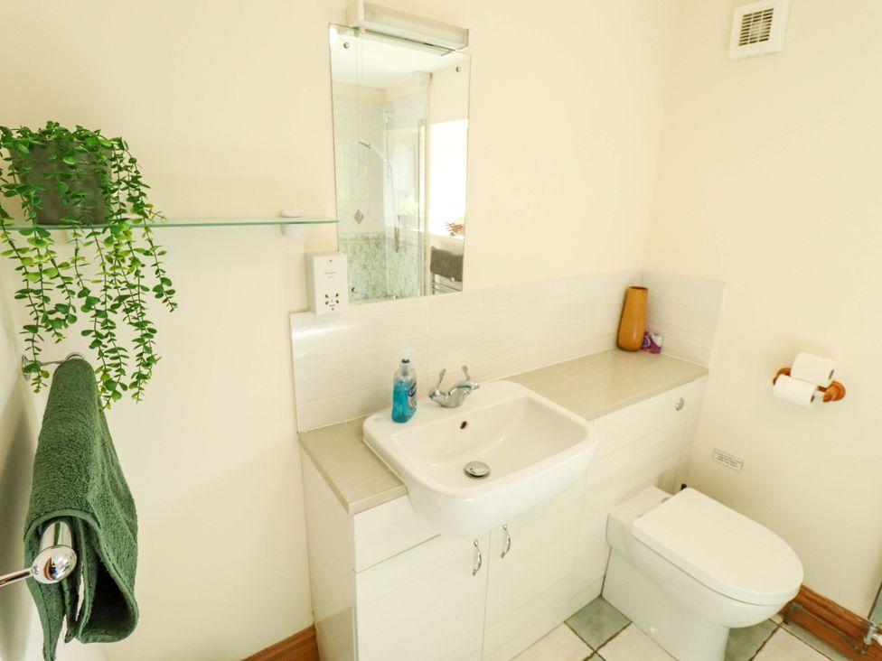 A bathroom with a sink and toilet at Barn Owl near Louth