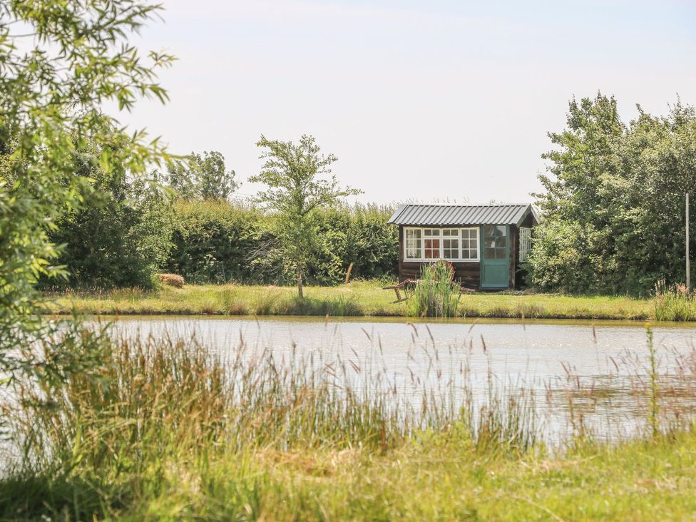 A shed near a pond at Kingfisher in Louth