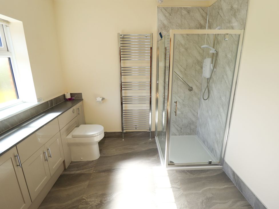 A bathroom featuring a shower and sink at Kingfisher Near Louth