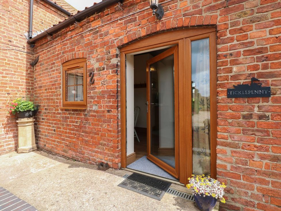 An entrance with brick wall and front door at Ticklepenny in Louth