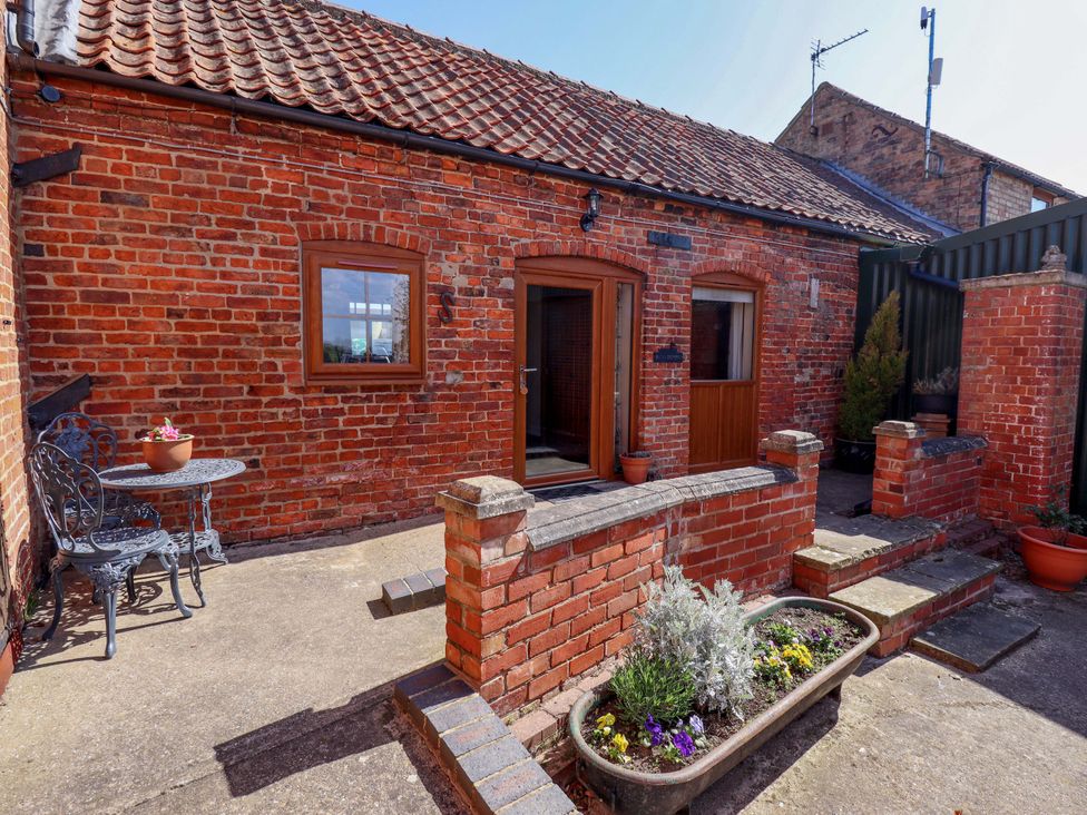 An outdoor area with a table and chairs at Ticklepenny in Louth