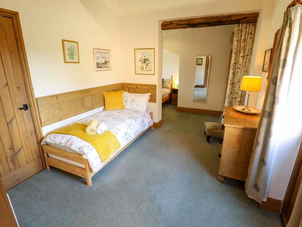 A bedroom with a single bed and dresser at Ticklepenny in Louth