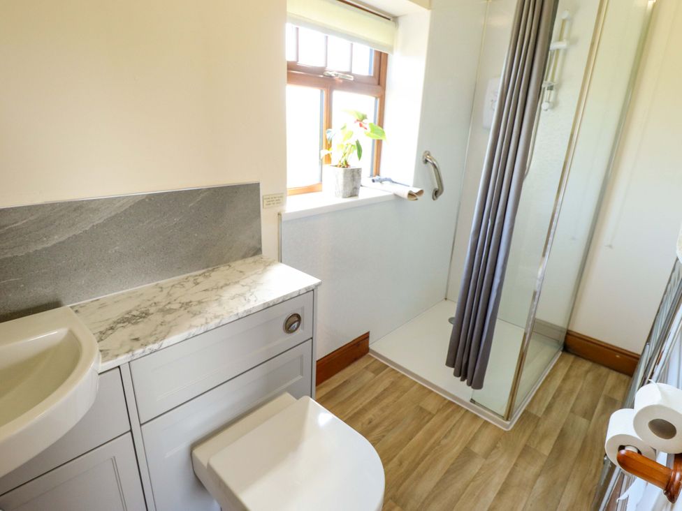 A bathroom with a shower and sink at Ticklepenny in Louth