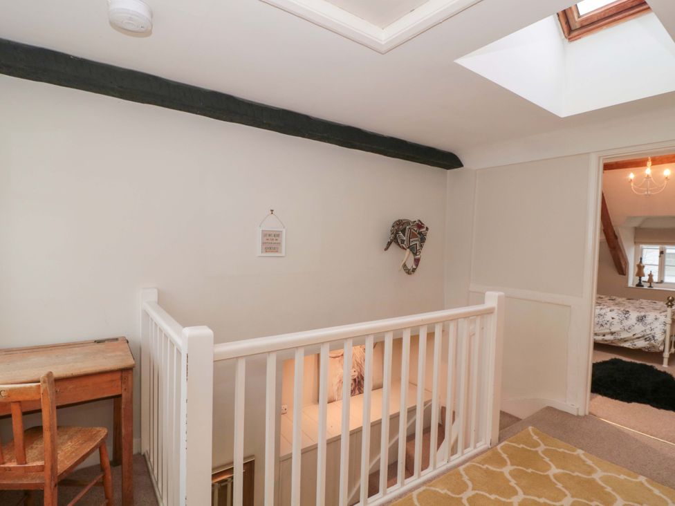 A landing with a desk and chair at Stones Bakery in Wedmore