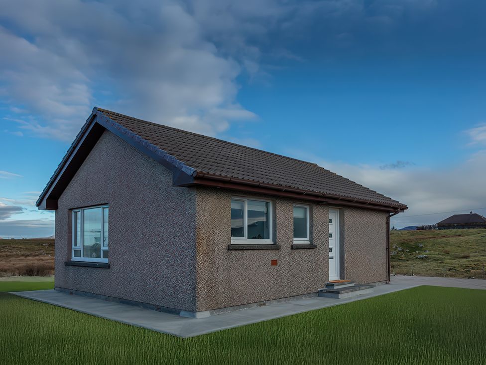 A house with windows and a door at 365 South Boisdale Daliburgh Isle Of South Uist