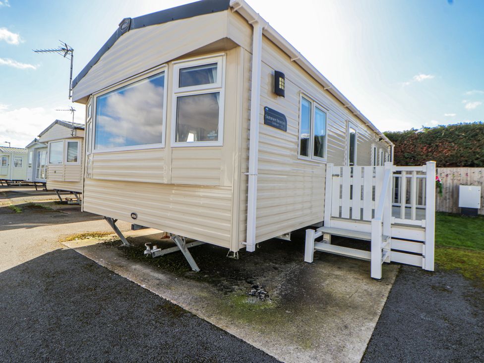 A caravan with a staircase at St Michaels Caravan Park - 236 Towyn