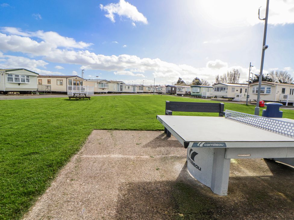 A table tennis table in an outdoor area at St Michaels Caravan Park - 236 Towyn