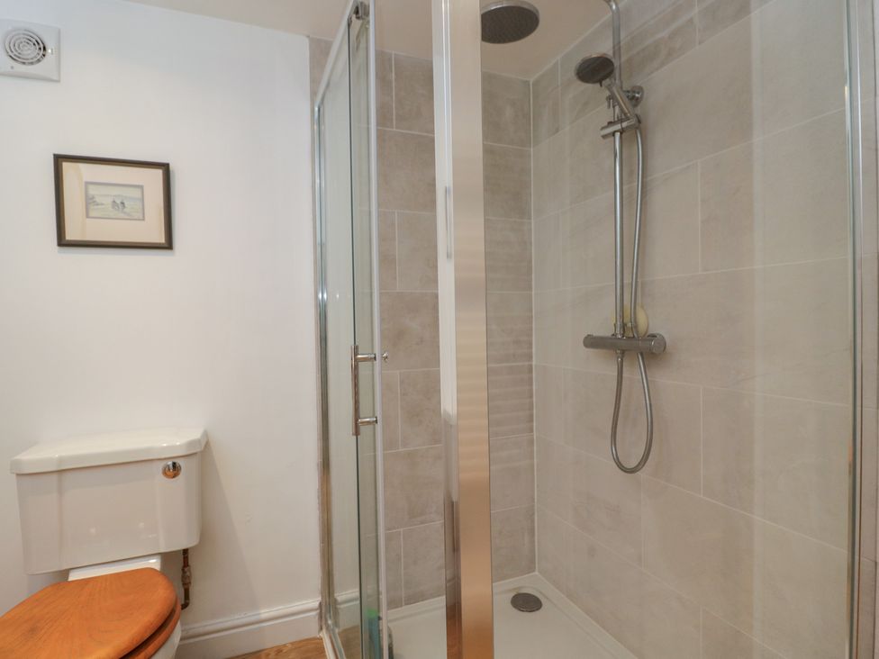 A bathroom with a shower and toilet at Gardeners Hill Annex