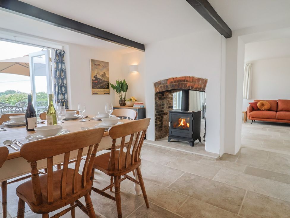 A dining room with a table set for dinner at The Old Inn Winterborne Whitechurch