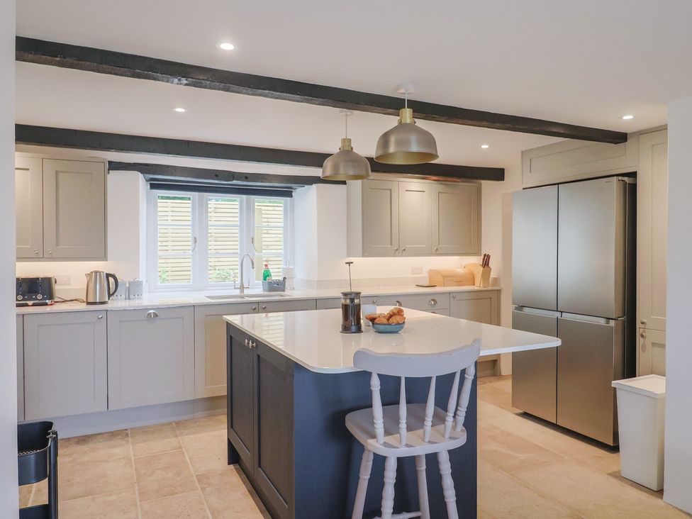 A kitchen with modern appliances and a countertop at The Old Inn Winterborne Whitechurch