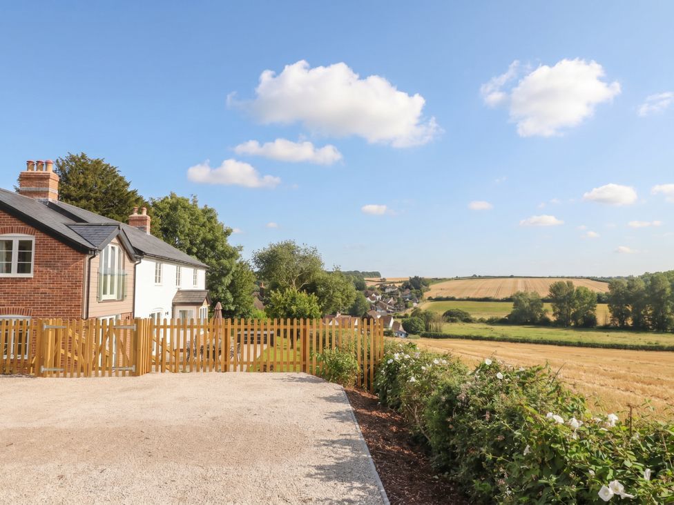 An outdoor view of houses and fields at The Old Inn in Winterborne Whitechurch