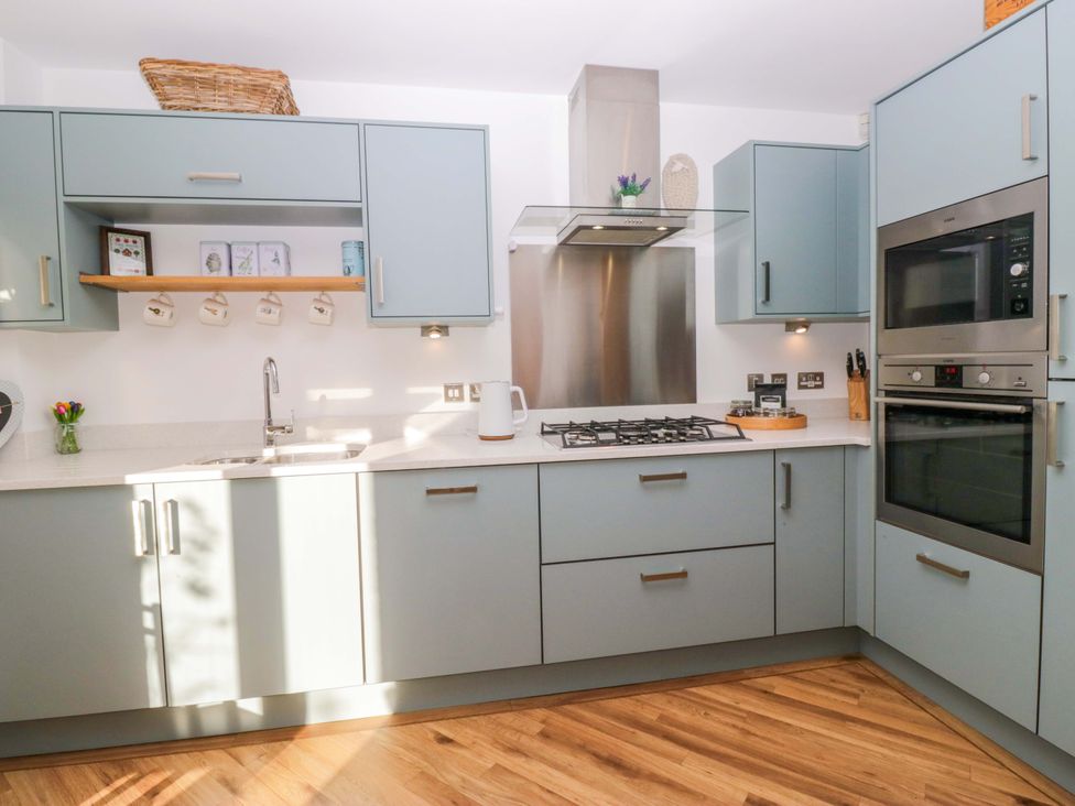 A kitchen with cabinets and appliances at 27 Oversands View