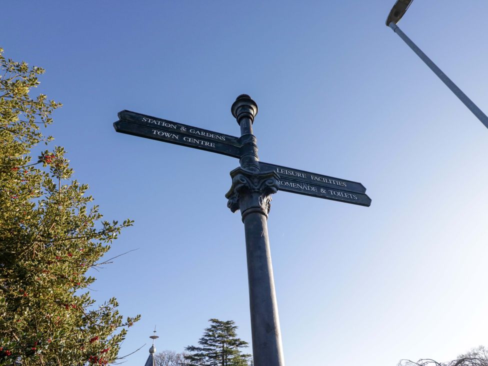 A signpost indicating directions to various locations at 27 Oversands View 