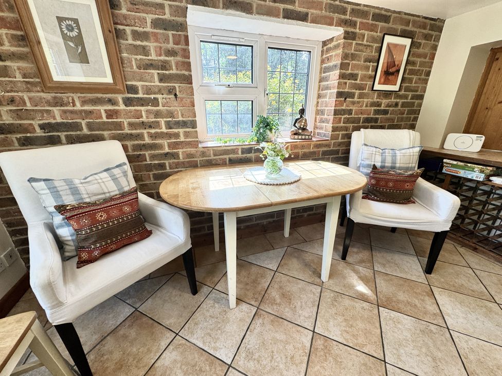 A snug with a table and armchairs at Forest Break in Southampton