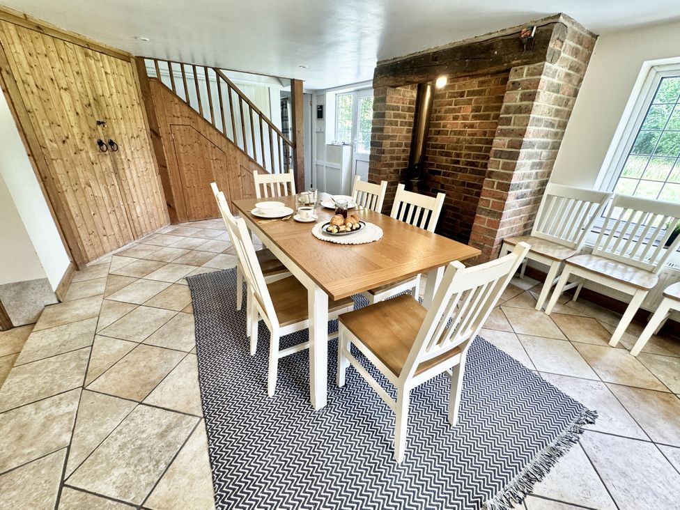 A dining room with a table and chairs at Forest Break Southampton