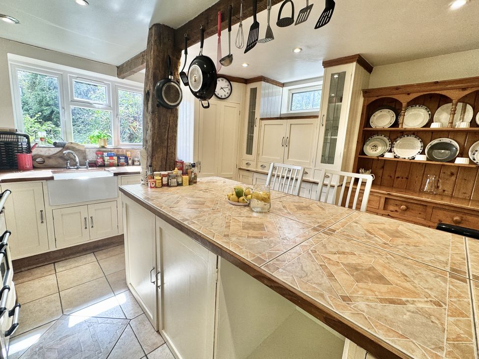 A kitchen with cabinets and a countertop at Forest Break in Southampton