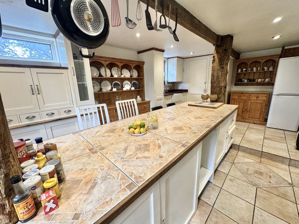 A kitchen with an island and shelves at Forest Break in Southampton