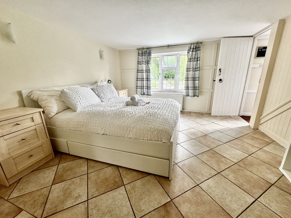 A bedroom with a bed and a window at Forest Break in Southampton