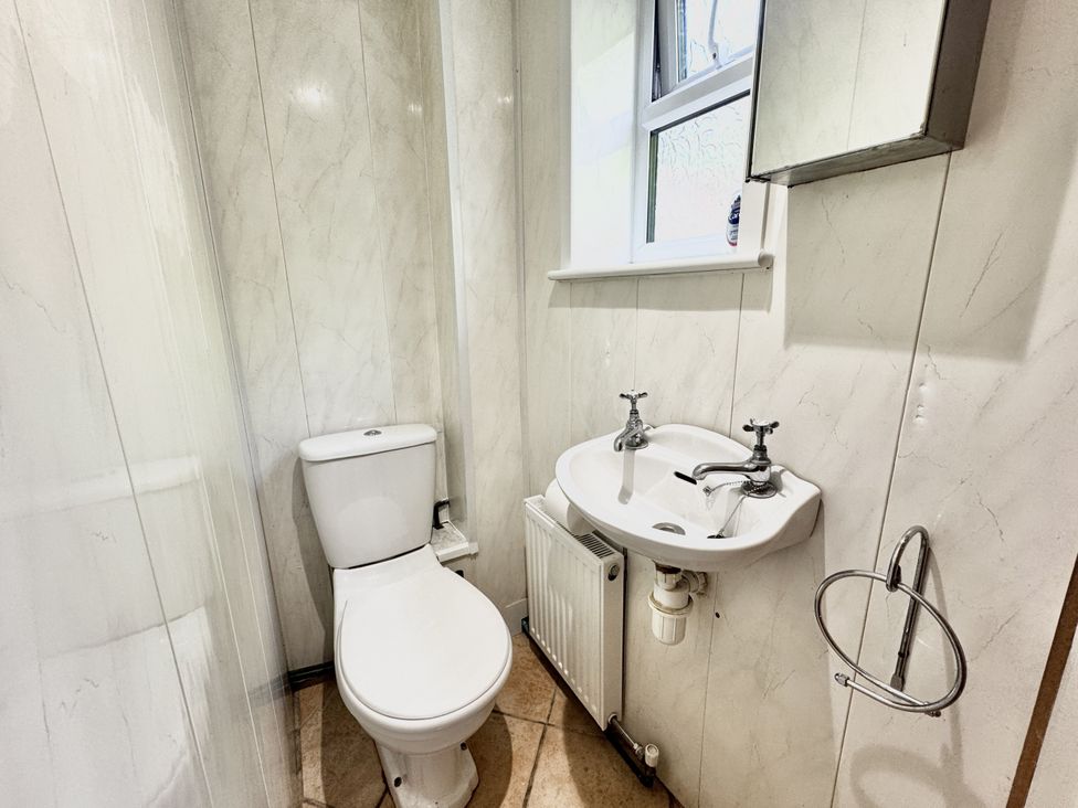 A bathroom with a toilet and sink at Forest Break in Southampton