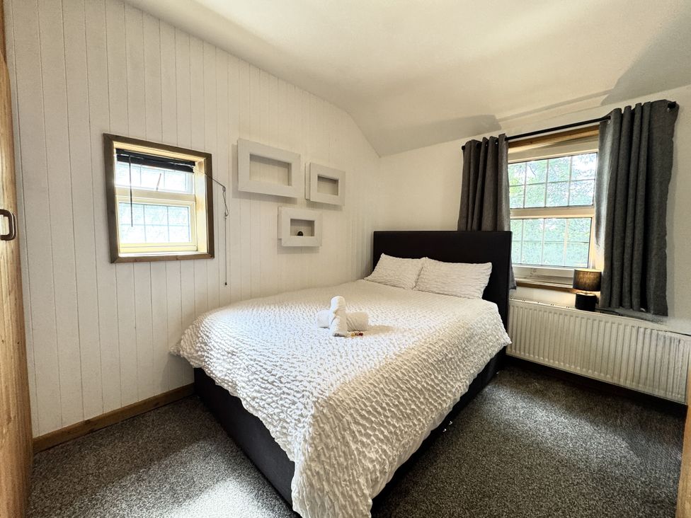 A bedroom with a bed and window at Forest Break in Southampton