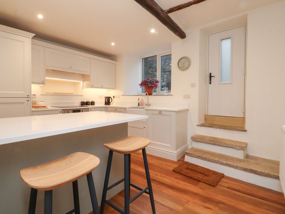 A kitchen with a sink and countertop at Cobble Cottage in Clitheroe