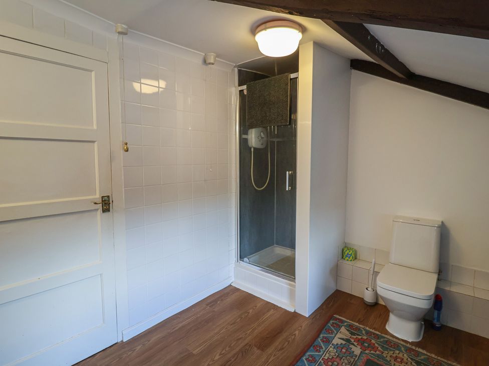 A bathroom with a shower and toilet at Farmhouse in Beccles
