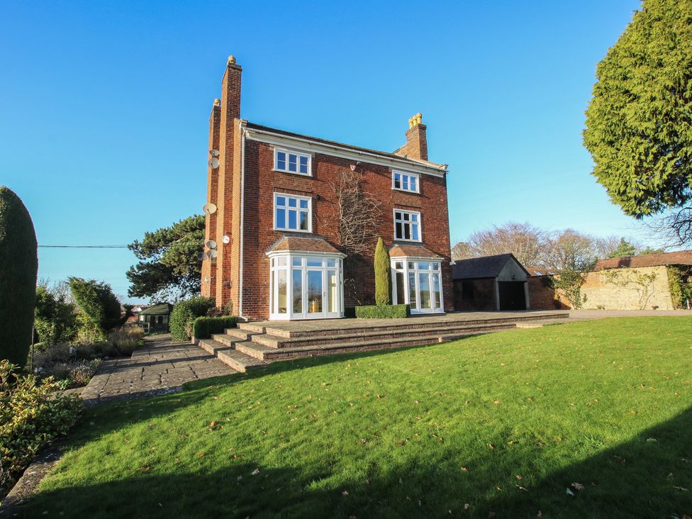 A house with a garden and steps at The Mill House in 