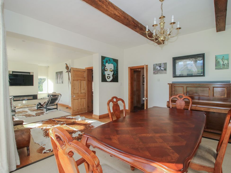 A dining room with a table and chairs at The Mill House