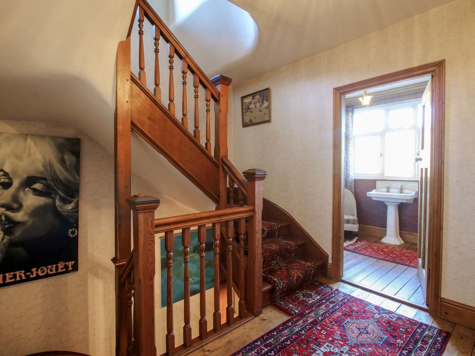 A staircase with a sink in a hallway at The Mill House