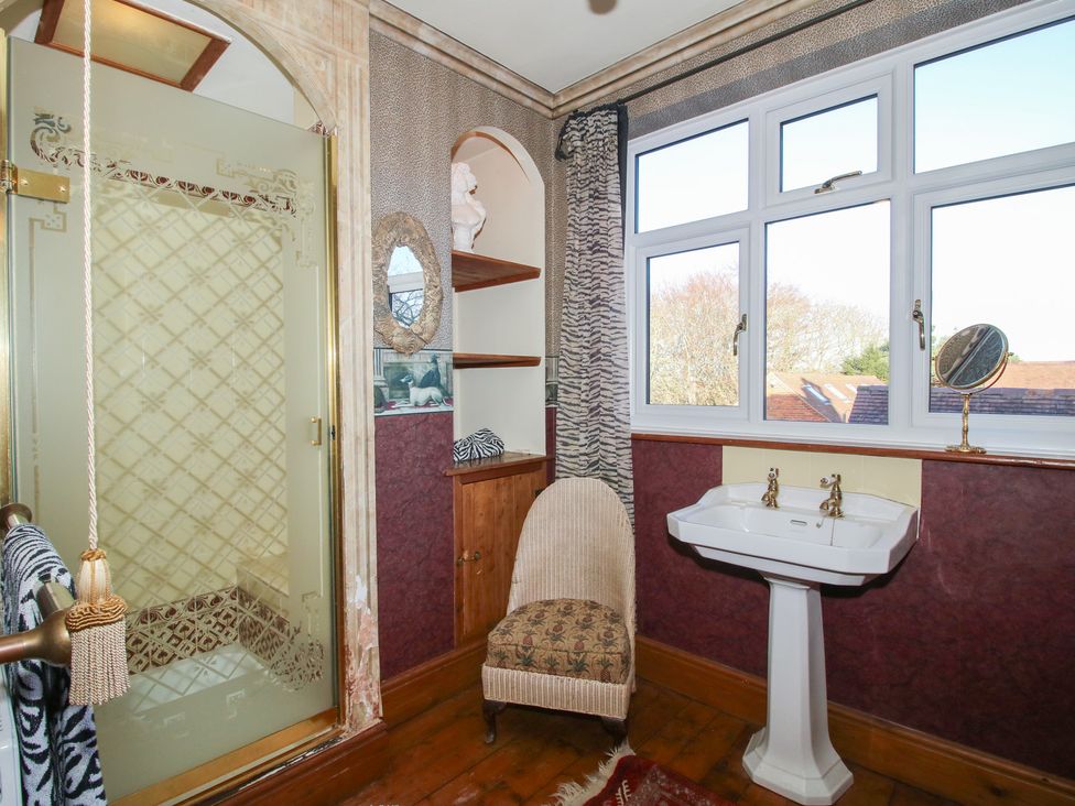 A bathroom with a shower and sink at The Mill House in 