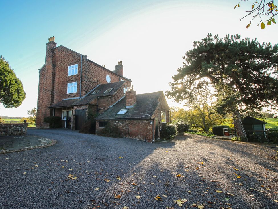 A house with a driveway and garden at The Mill House in 