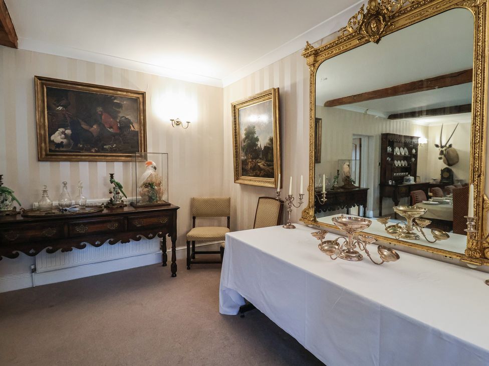 A dining room with a table and chair at Winston Lodge in Beccles