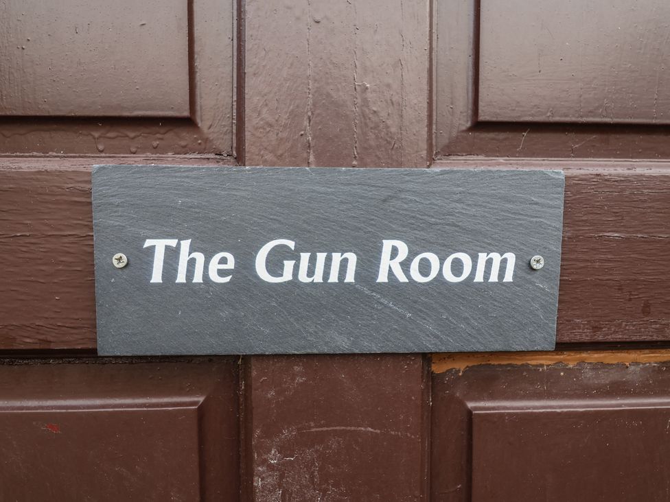 A sign that reads The Gun Room on a door at The Gun Room in Beccles