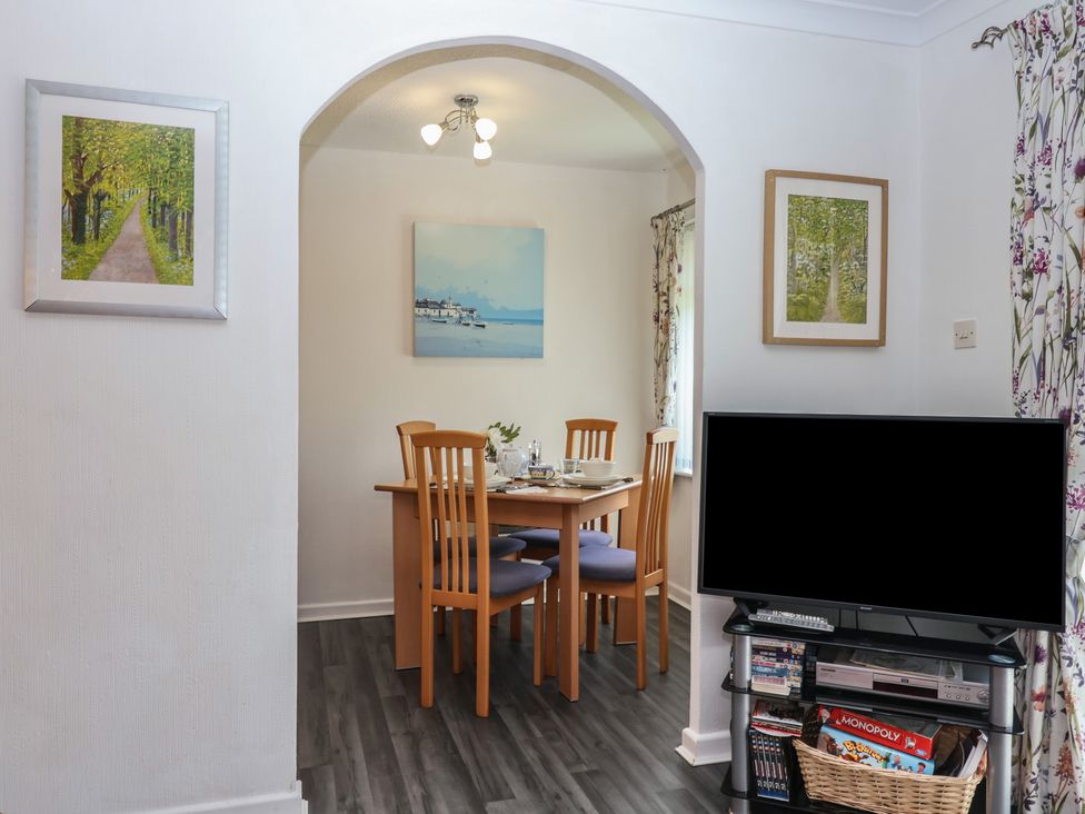 A dining room with a table and chairs at Westview in Liskeard