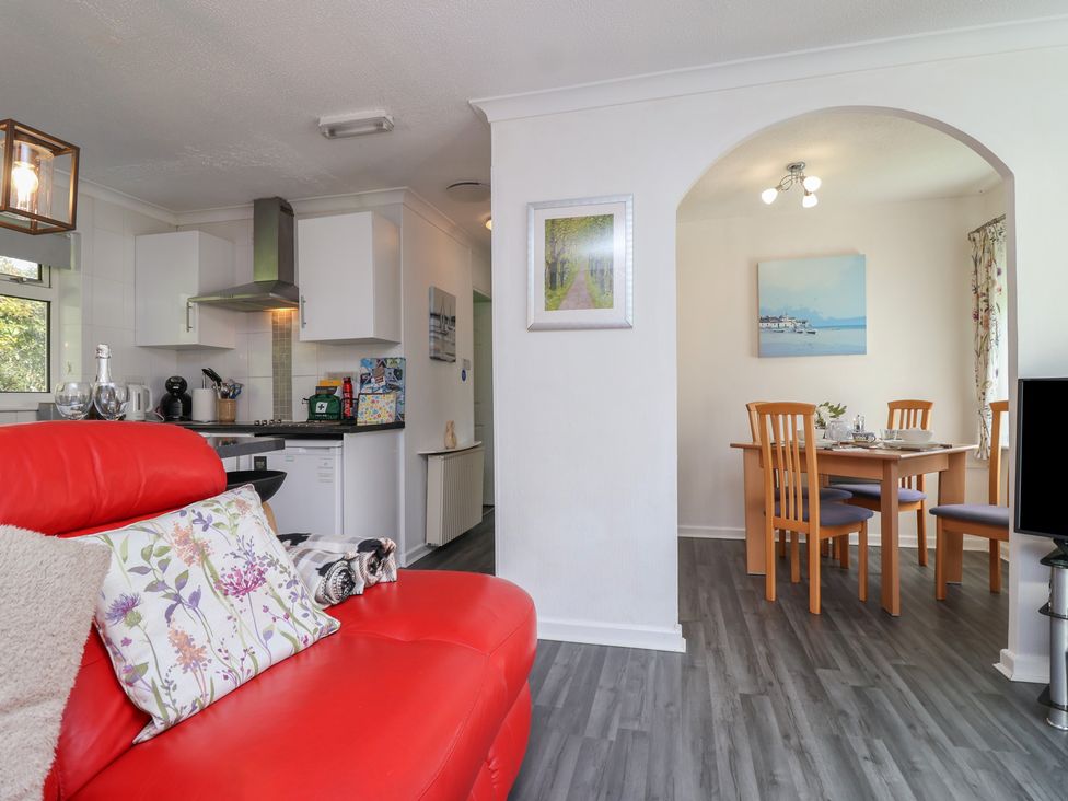 A living room with a dining area and kitchen at Westview in Liskeard