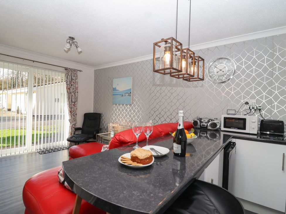 A living room with a dining table and chairs at Westview in Liskeard