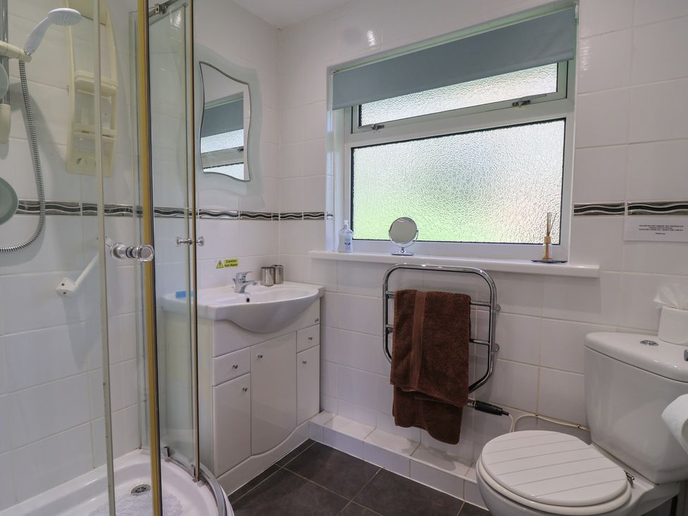 A bathroom with shower, sink, and toilet at Westview in Liskeard