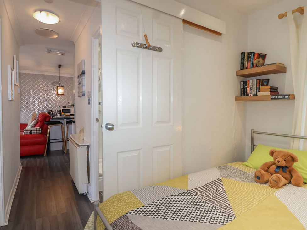 A bedroom with a bed and teddy bear at Westview in Liskeard