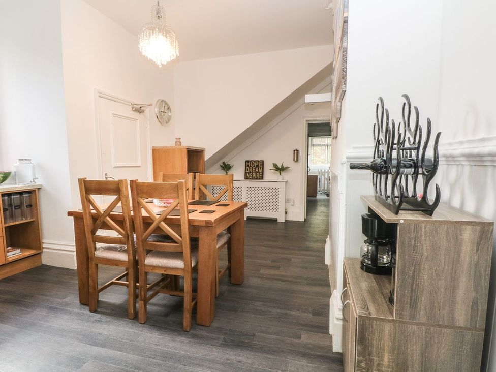 A dining room with a table and chairs at Beechwood House in Hadfield