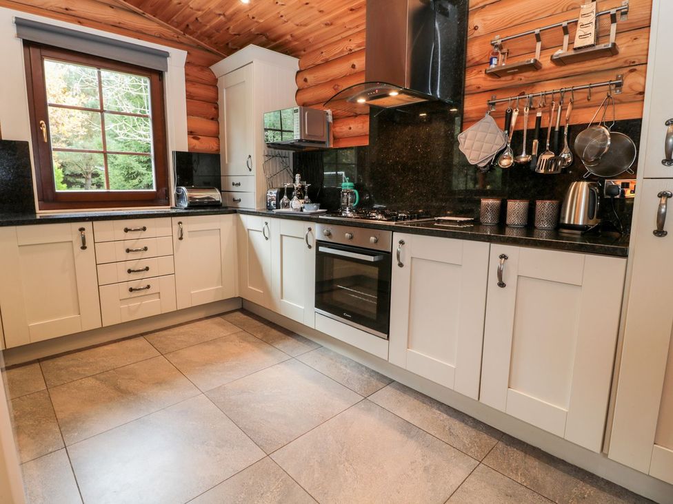 A kitchen with cabinets and countertop at Little Bears Hideaway @ 23 Lakeside Felmoor Park near Felton
