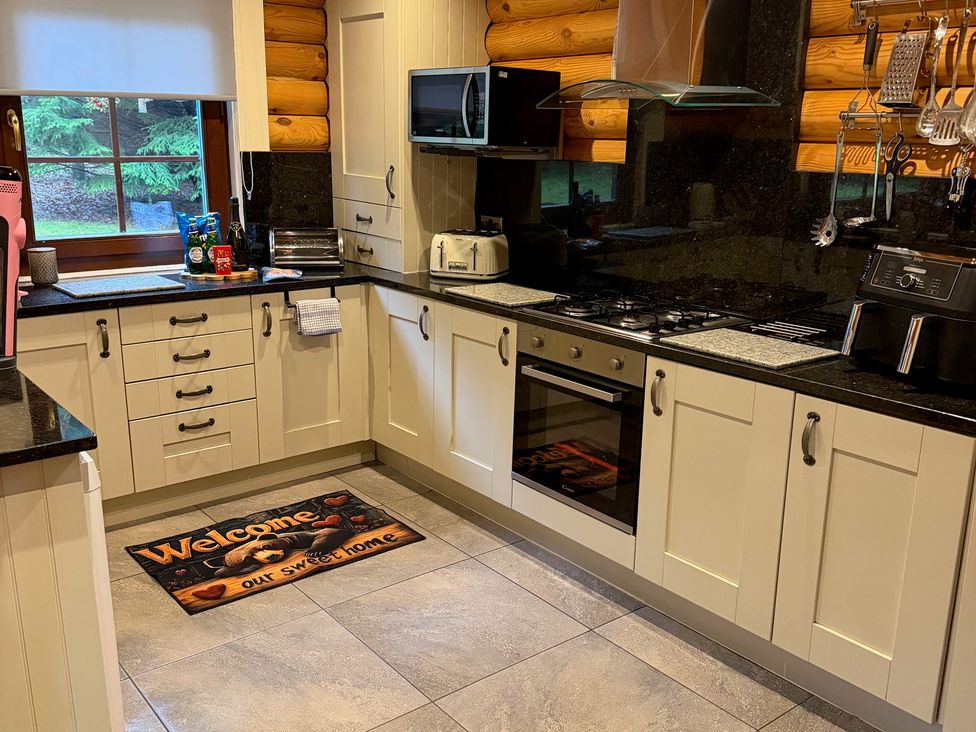 A kitchen with appliances and countertops at Little Bears Hideaway @ 23 Lakeside Felmoor Park near Felton